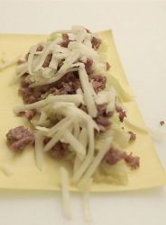 cannellone farcito con verza, salsiccia e provolone